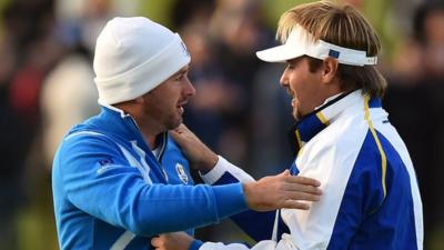 Graeme McDowell and Victor Dubuisson celebrate their foursomes win on Friday afternoon