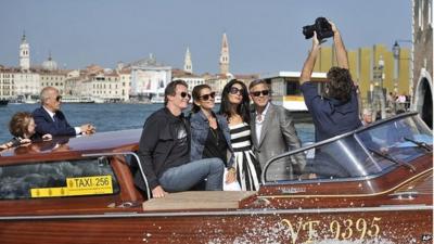 George Clooney and Amal Alamuddin on a water taxi ride in Venice