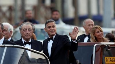 George Clooney on the Canal Grande on the way to his wedding with Amal Alamuddin, in Venice