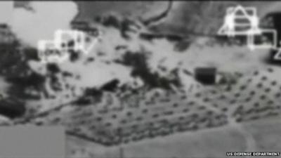 Black and white footage showing air strike on Kobane