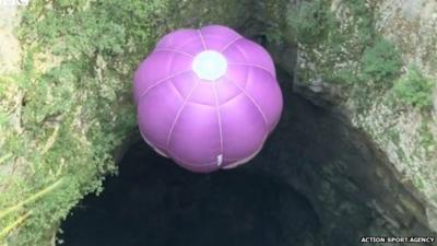Austrian balloon pilot Ivan Trifonov descends into cave