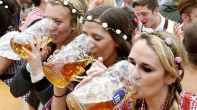 Visitors enjoy beer during visit to Oktoberfest