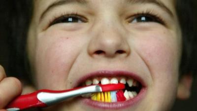 Boy brushing teeth