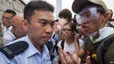 Protester arguing with police officer