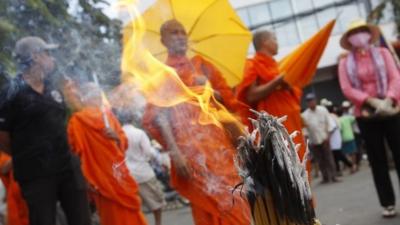 Buddhist monks and other protesters gather near the Vietnamese embassy