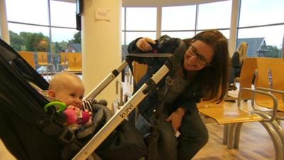 Mother with baby in pram