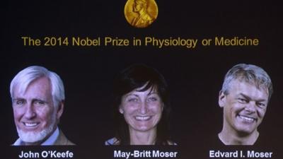 A screen displays the winners of the 2014 Nobel Medicine Prize