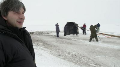 Brian Cox with the returning cosmonauts in the Kazakhstan steppes