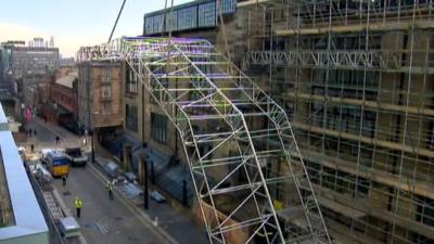 Temporary roof is hoisted into place at Glasgow School of Art