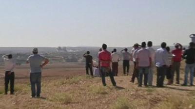 People watch Kobane