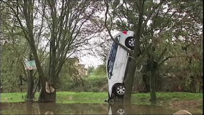 Car in tree after flash flood in Montpellier, France