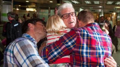 Ray Cole hugging family