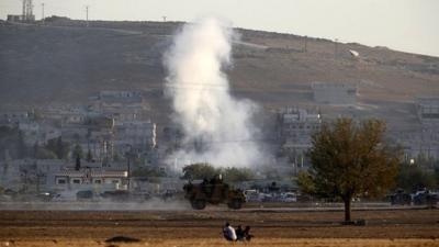 smoke rises from Kobane, seen from Turkish border
