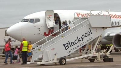 Passengers boarding an aircraft at Blackpool Airport