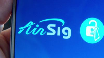 Close up of smartphone screen showing AirSig logo