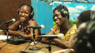 Radio presenting team in studio