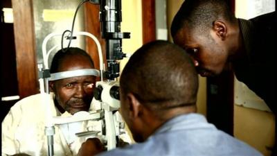 Man getting his eyes checked.