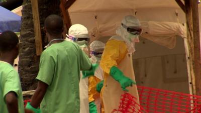 Medical workers in protective suits