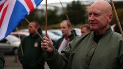Britain First supporter holding union jack