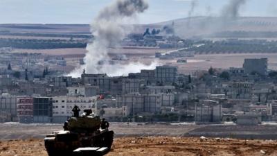 Tank overlooking Kobane