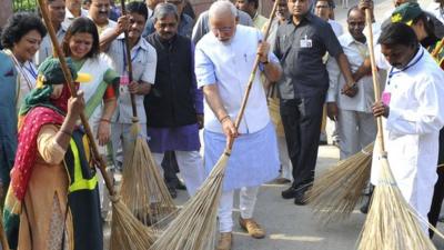 Indian Prime Minister Narendra Modi with a broom