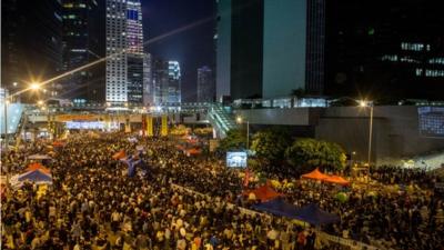 Thousands of pro-democracy protesters in Hong Kong fill what has now been called " Umbrella Square" at Admiralty