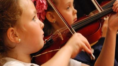 Girls playing violin