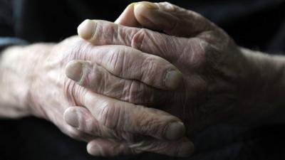 Hands of a generic old man