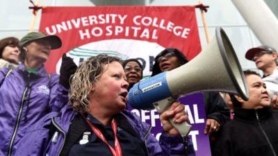NHS workers gather to strike outside hospital