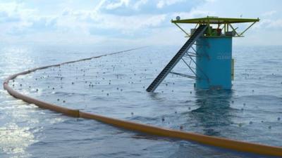 Artist's impression of the Ocean Clean-up platform and barrier out at sea