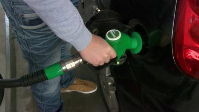 Man filling up car with unleaded petrol