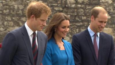 File picture of the Duke and Duchess of Cambridge, and of Prince Harry (L)