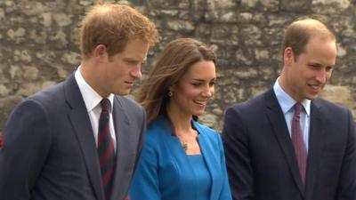 File picture of the Duke and Duchess of Cambridge, and of Prince Harry (L)