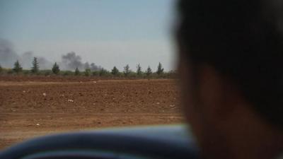 A plume of smoke in the distance