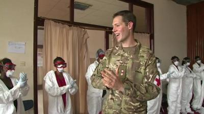 A soldier teaching health workers