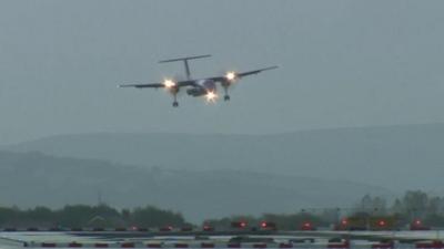 Plane comes in to land at Manchester Airport