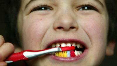 Boy brushing teeth