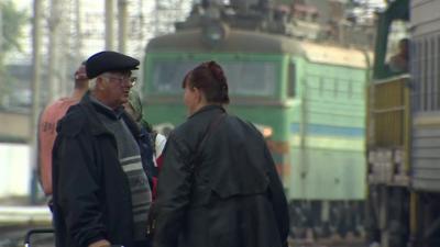People at a train station in Ukraine