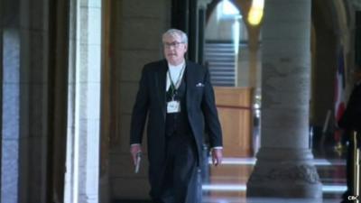 Kevin Vickers holding a gun