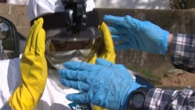 Man in mask to protect against Ebola
