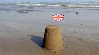 Sand castle with flag