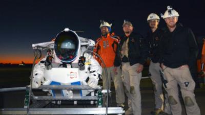 Alan Eustace in a space suit before he is lifted by a helium balloon