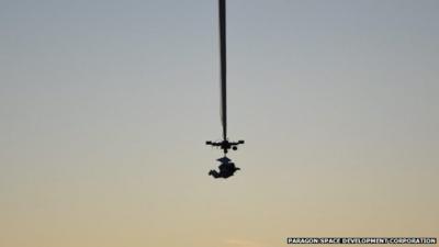 Alan Eustace, Google senior Vice-President as he is lifted by a helium balloon from an abandoned airfield near Roswell, New Mexico