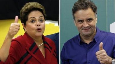 A combination photo shows presidential candidates President Dilma Rousseff (left)and Aecio Neves gesturing to photographers after voting on 5 October, 2014