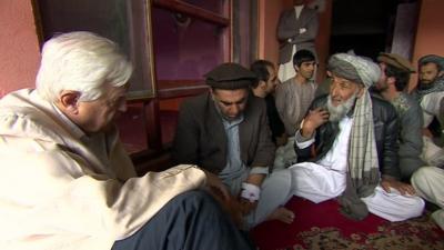 The BBC's John Simpson with local men in Kabul