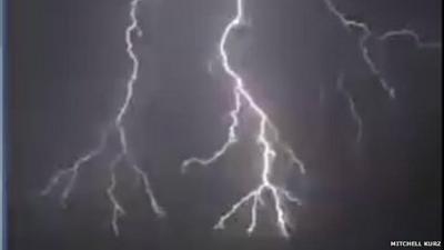 Still from footage by Mitchell Kurz showing dramatic lightning flash during Melbourne storm