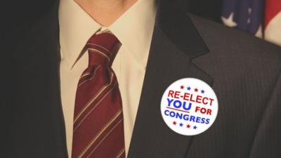 US congressional re-election button on jacket lapel