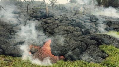 The lava flow from the Kilauea Volcano is seen in a U.S. Geological Survey (USGS) image taken near the village of Pahoa, Hawaii, at 10:00HST (20:00GMT) October 26, 2014