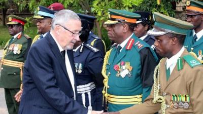 Dr Guy Scott greeting defence and security chiefs on Wednesday