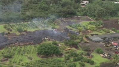 Lava approaching a house